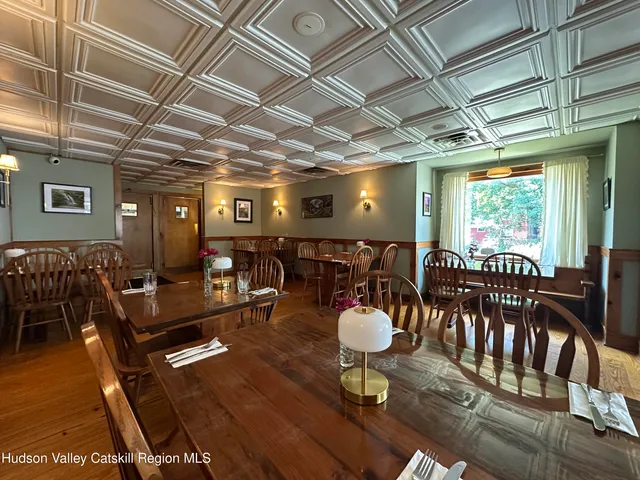 a view of a chairs and table in a patio