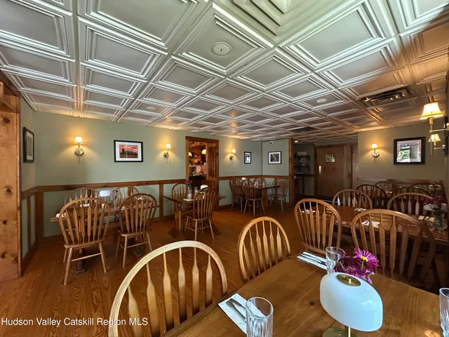 a view of a bathroom with a shower and a sink