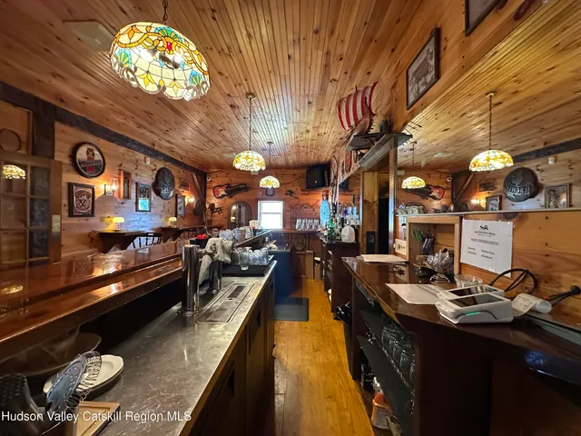 a bathroom with a sink toilet and a mirror