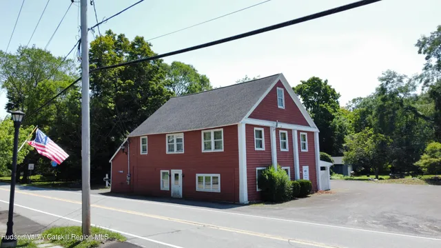 an aerial view of a house with a yard and garage