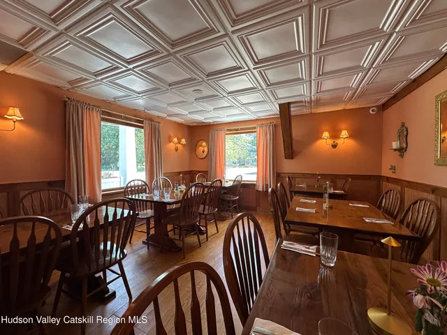 a view of a dining room with furniture window and outside view