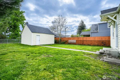 a view of a backyard with a garden and plants