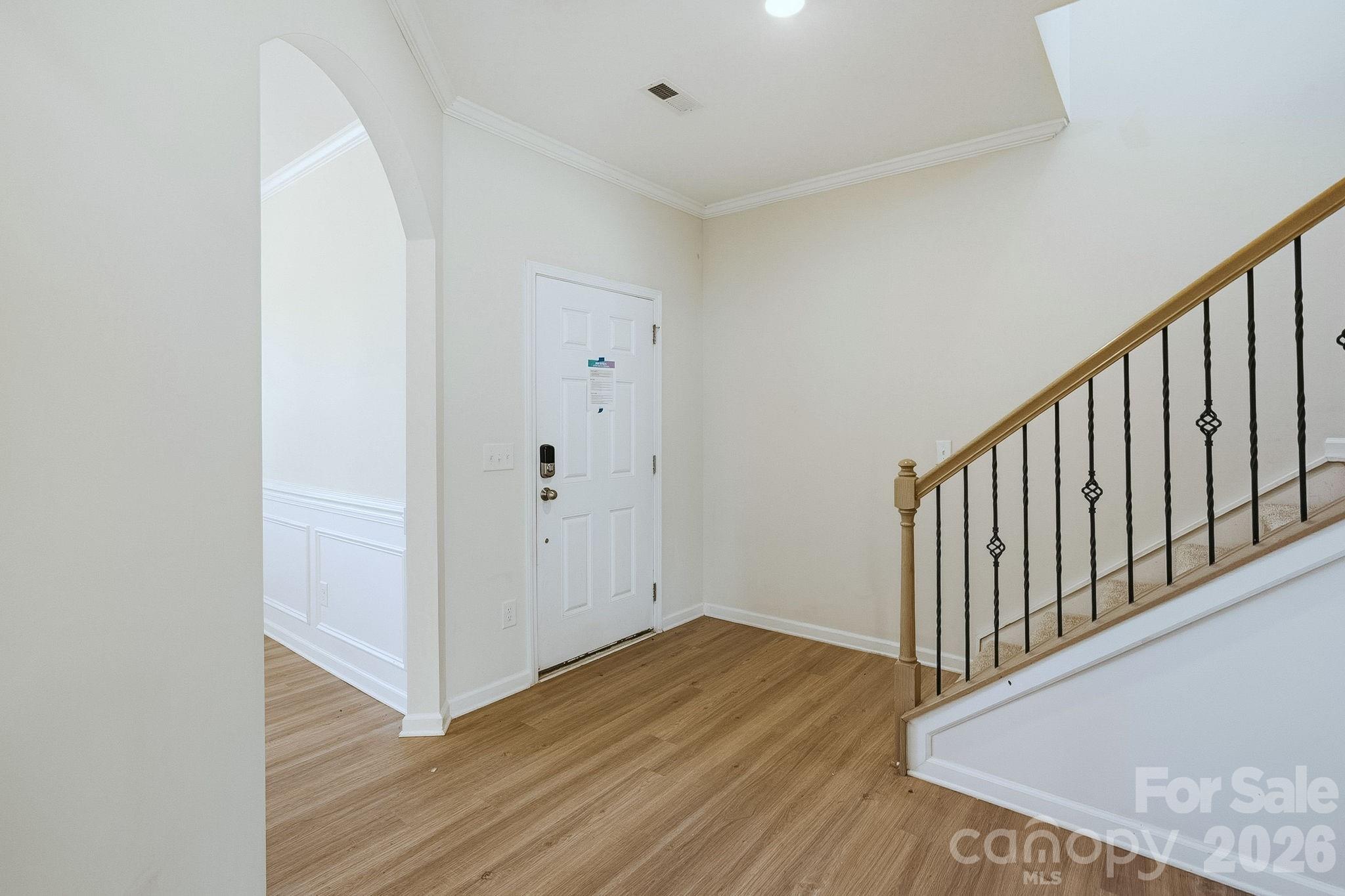 124 Tackle Troutman, NC 28166 - Photo 14 of 44 a view of a hallway with wooden floor