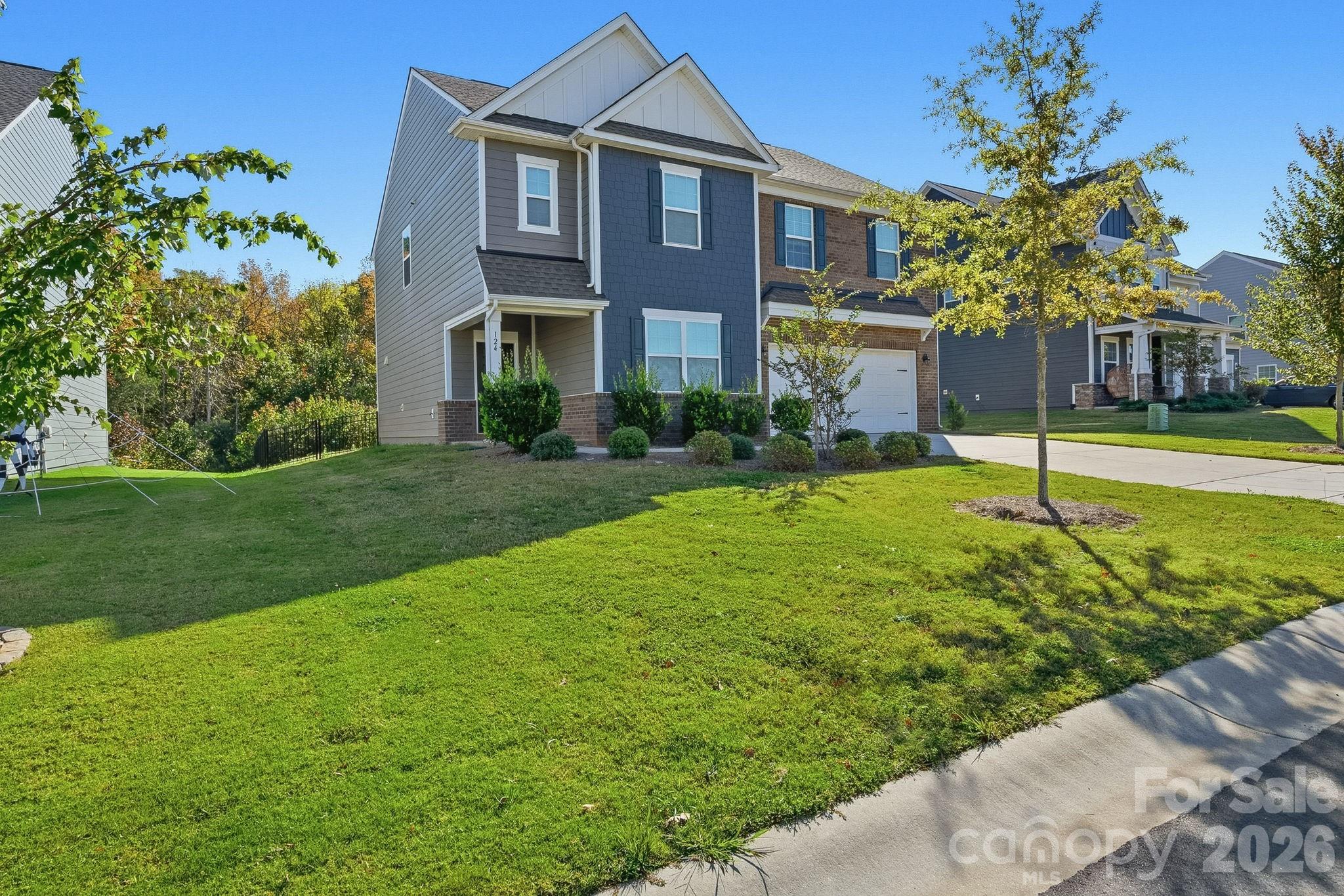 124 Tackle Troutman, NC 28166 - Photo 2 of 44 a front view of a house with a yard