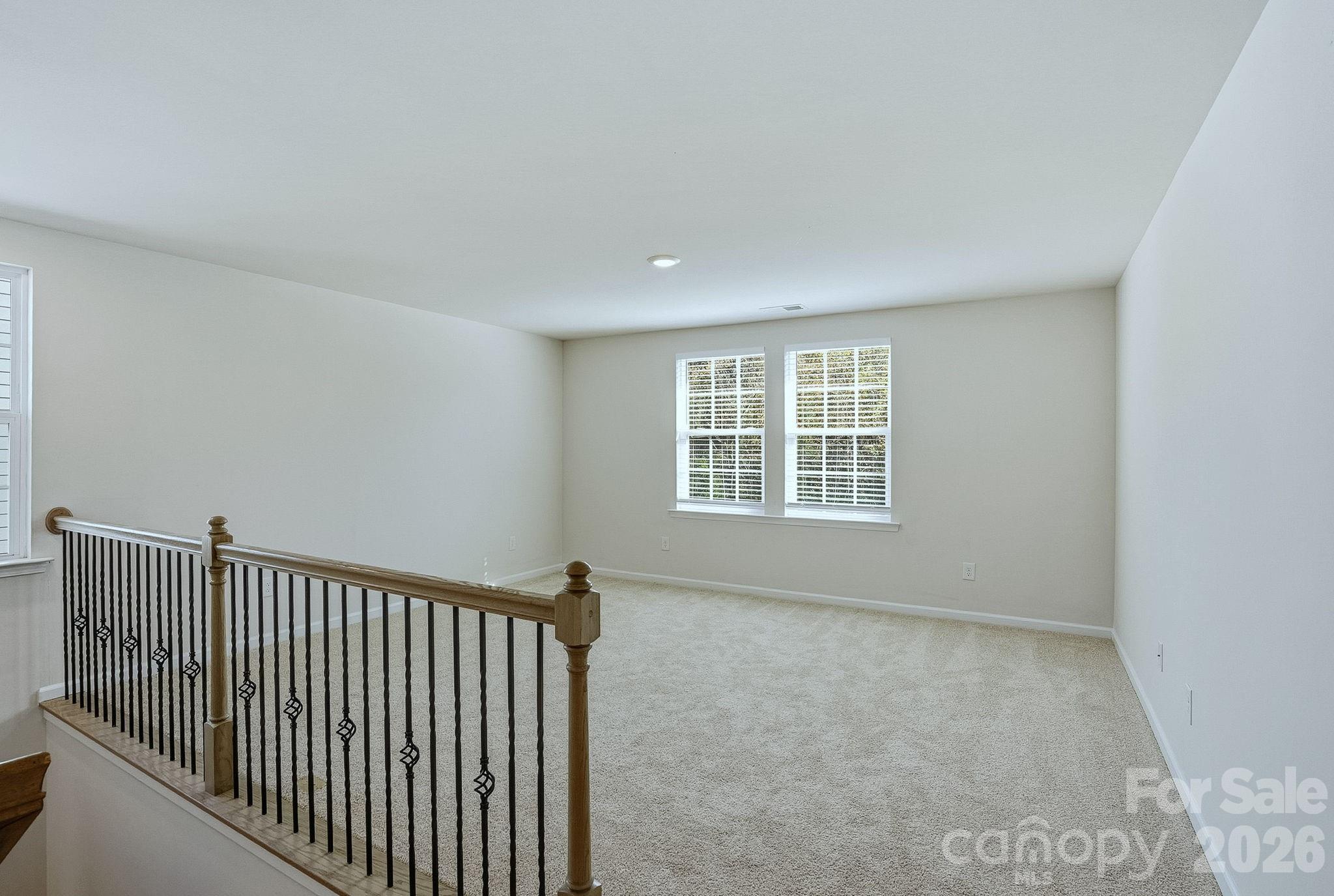124 Tackle Troutman, NC 28166 - Photo 25 of 44 a view of a hallway with window