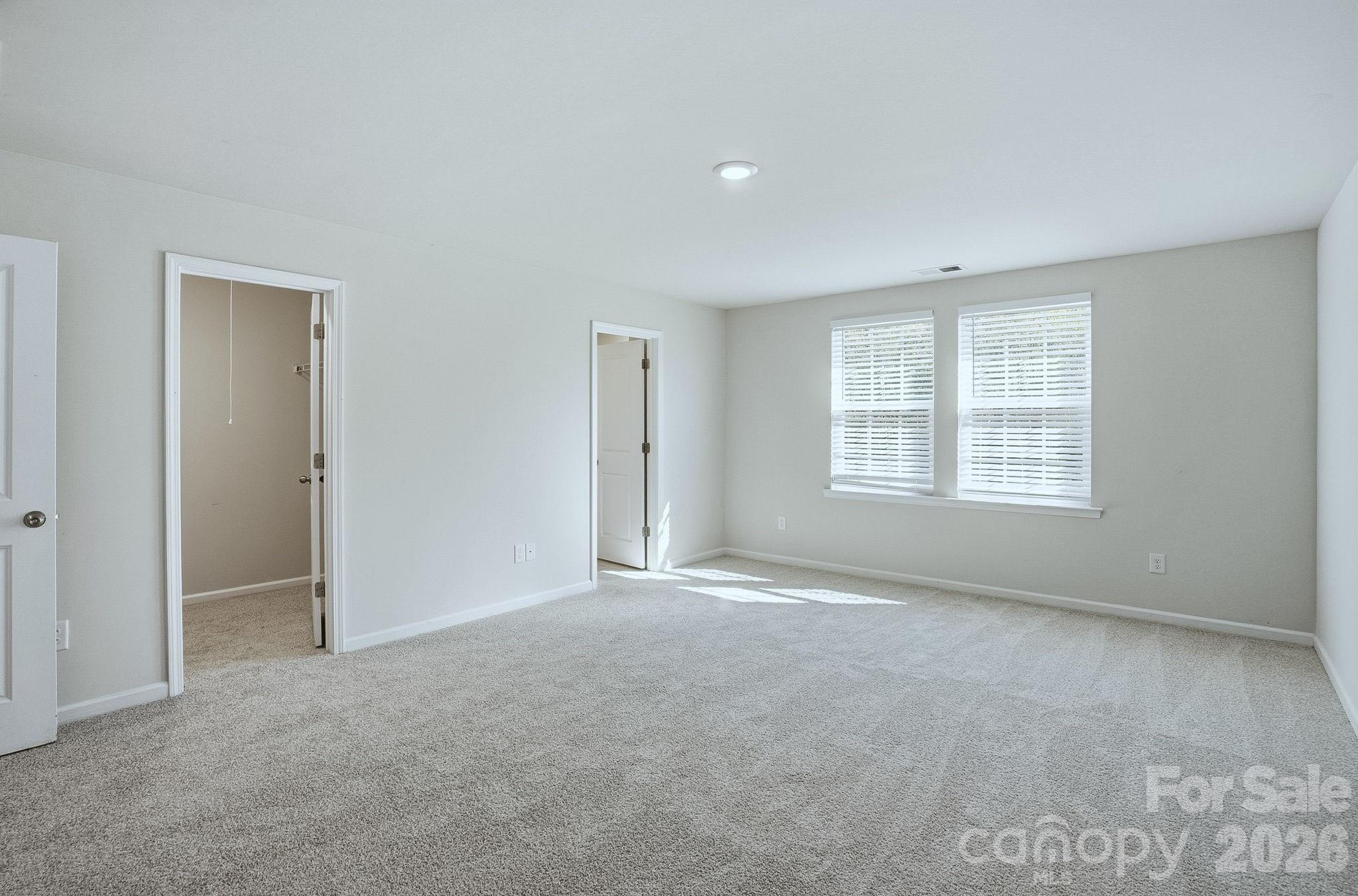 124 Tackle Troutman, NC 28166 - Photo 27 of 44 a view of an empty room with a window