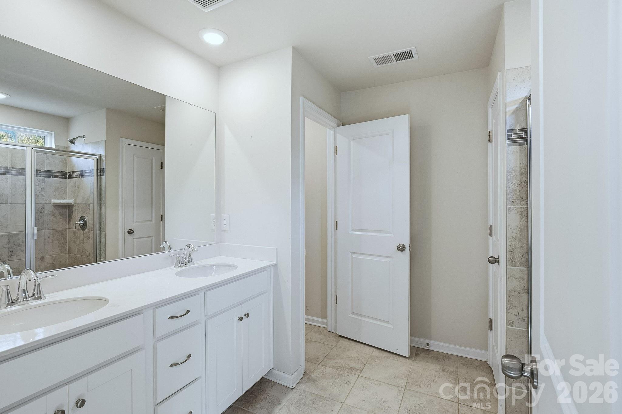 124 Tackle Troutman, NC 28166 - Photo 29 of 44 a spacious bathroom with a double vanity sink mirror and double