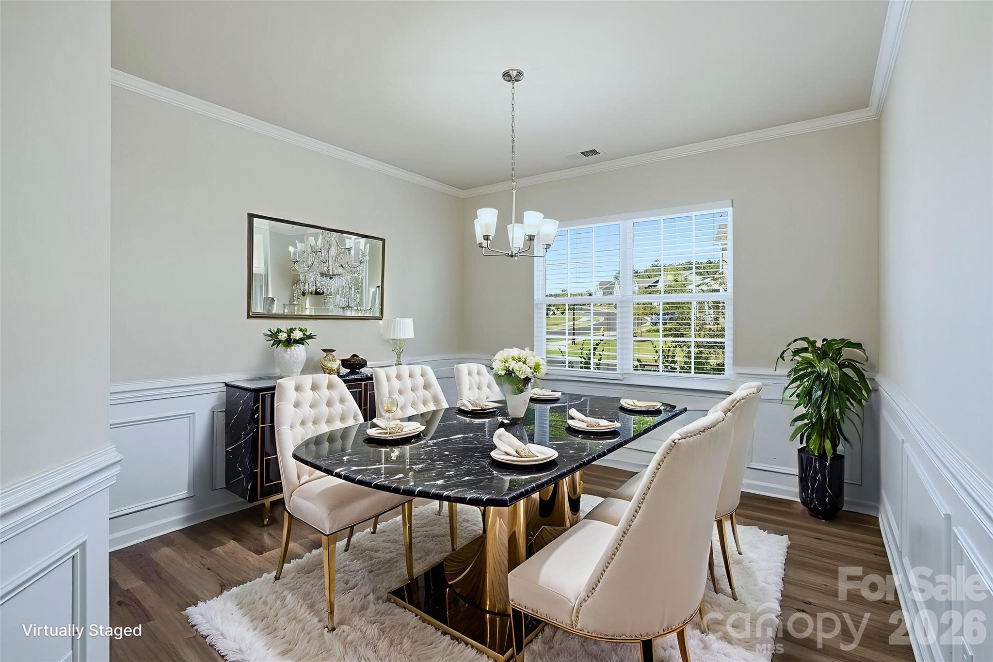 124 Tackle Troutman, NC 28166 - Photo 3 of 44 a dining room with furniture a chandelier and window