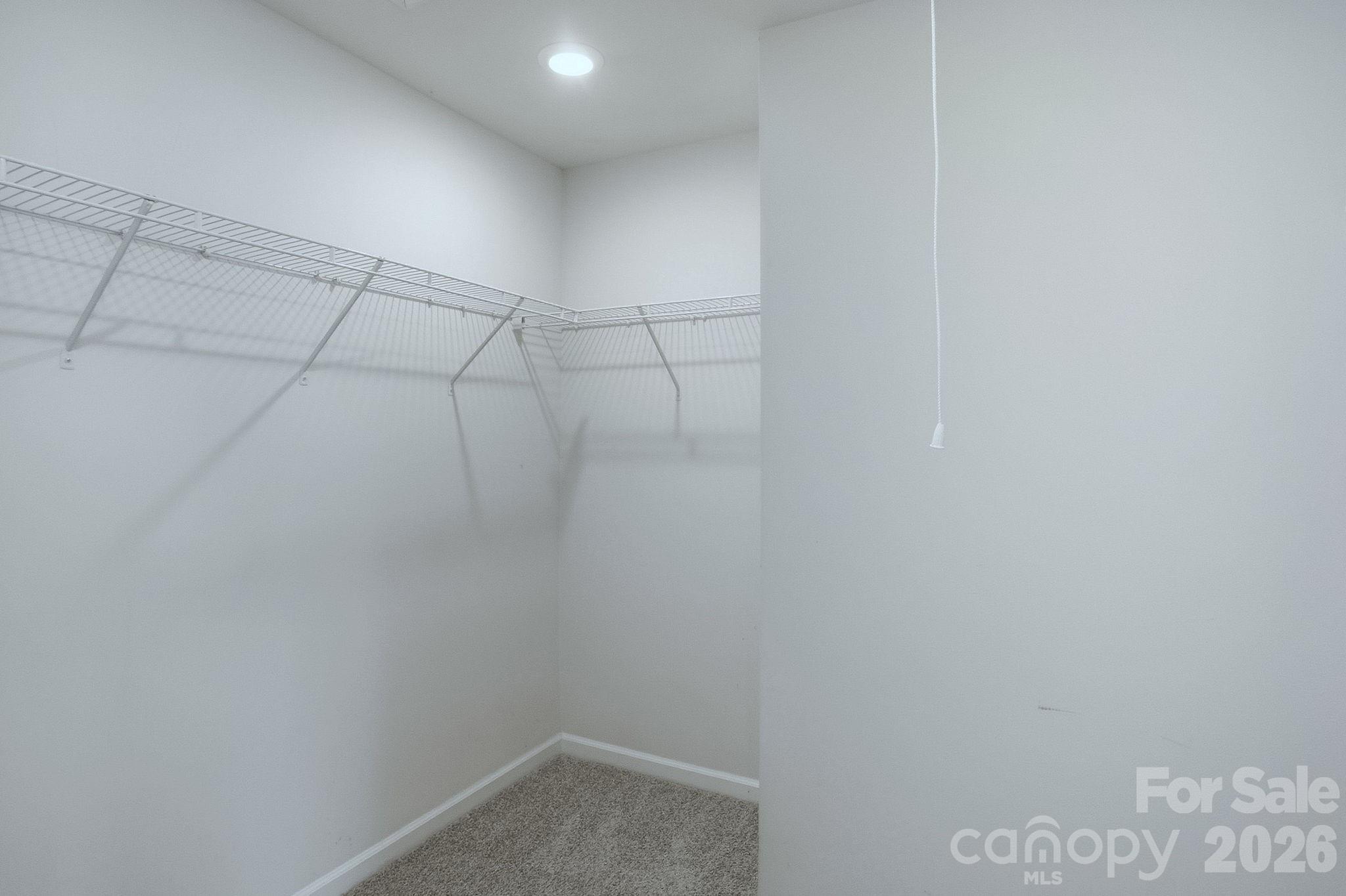 124 Tackle Troutman, NC 28166 - Photo 31 of 44 a view of a room with racks on the wall