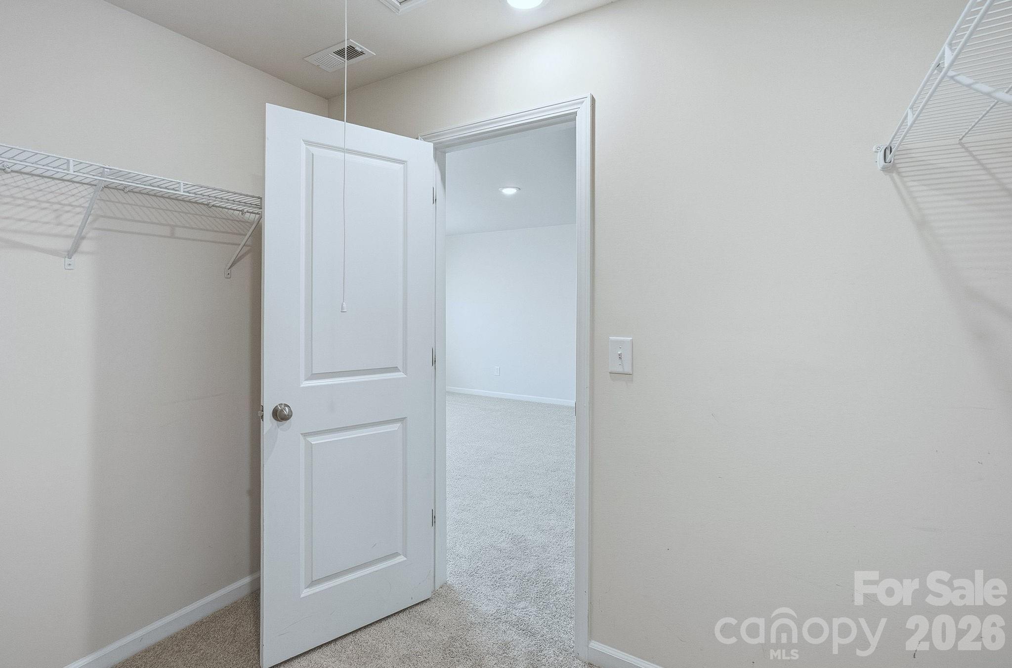 124 Tackle Troutman, NC 28166 - Photo 32 of 44 a bathroom with a shower and a glass door