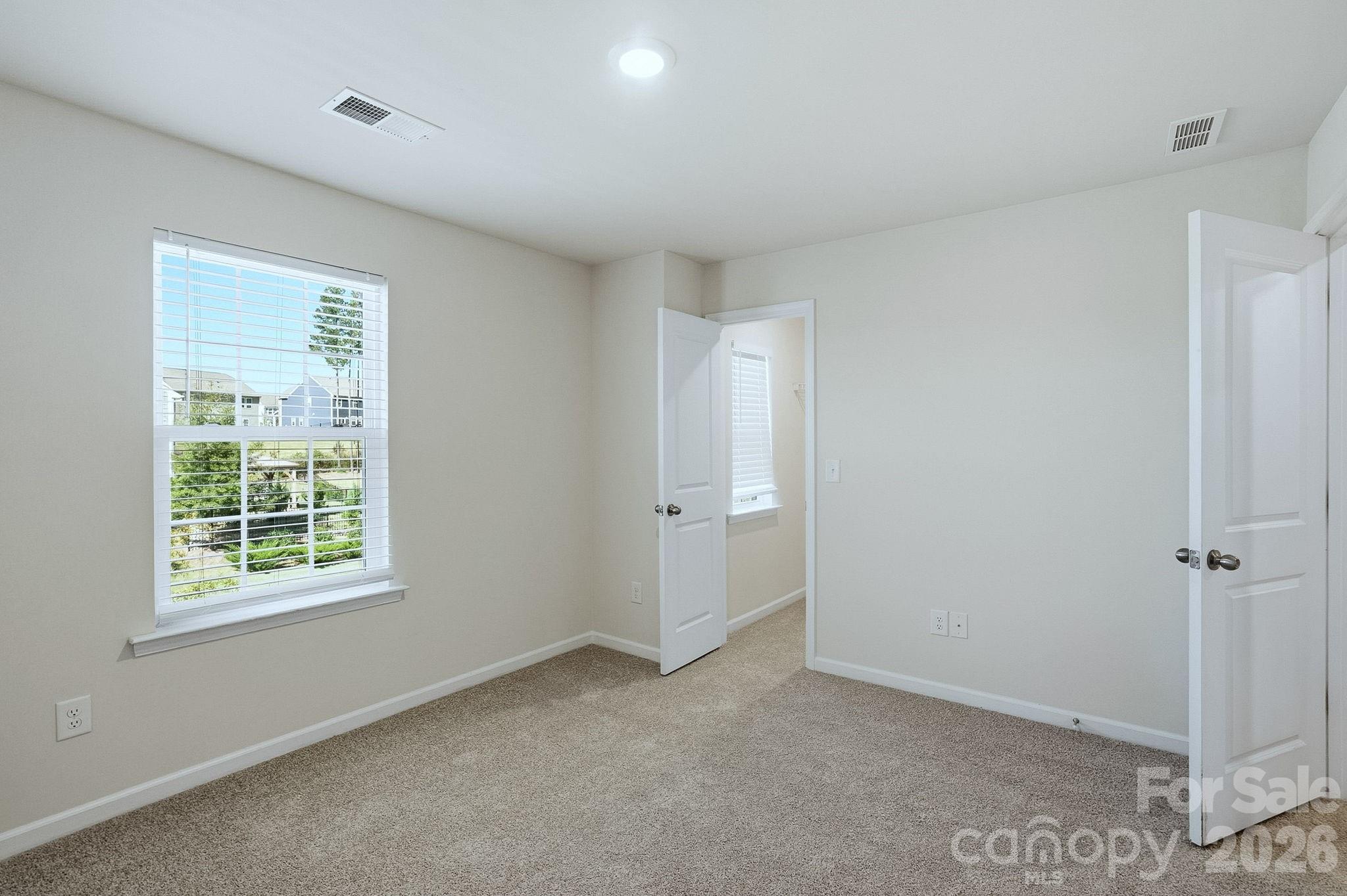 124 Tackle Troutman, NC 28166 - Photo 35 of 44 a view of an empty room with a window