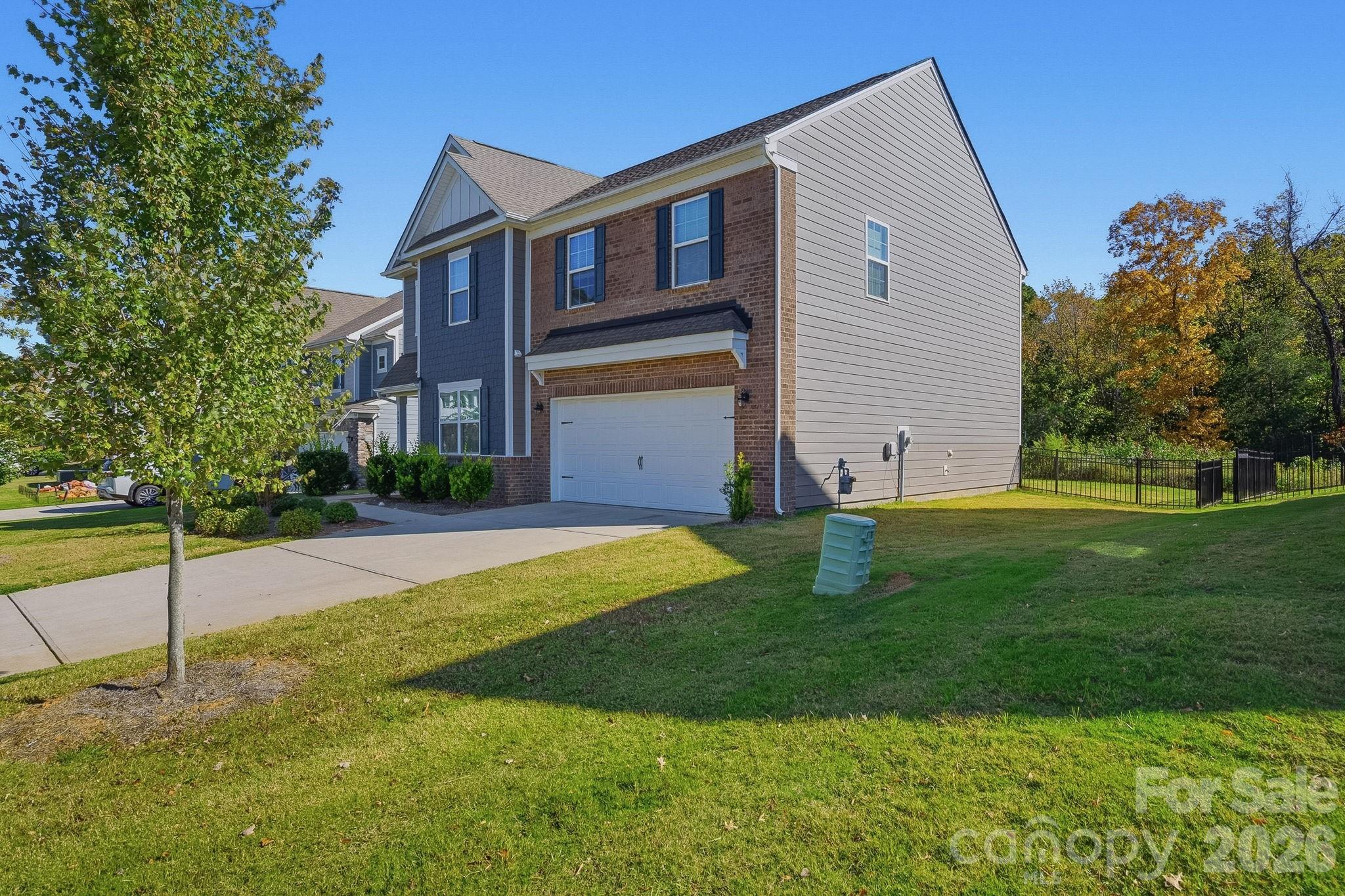 124 Tackle Troutman, NC 28166 - Photo 44 of 44 a front view of house with yard and green space