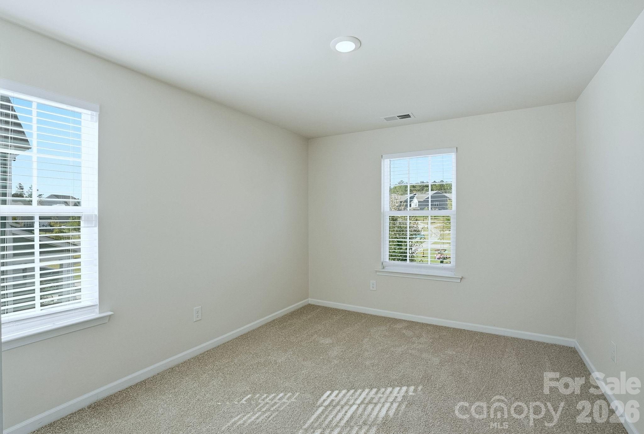 124 Tackle Troutman, NC 28166 - Photo 10 of 44 an empty room with a window