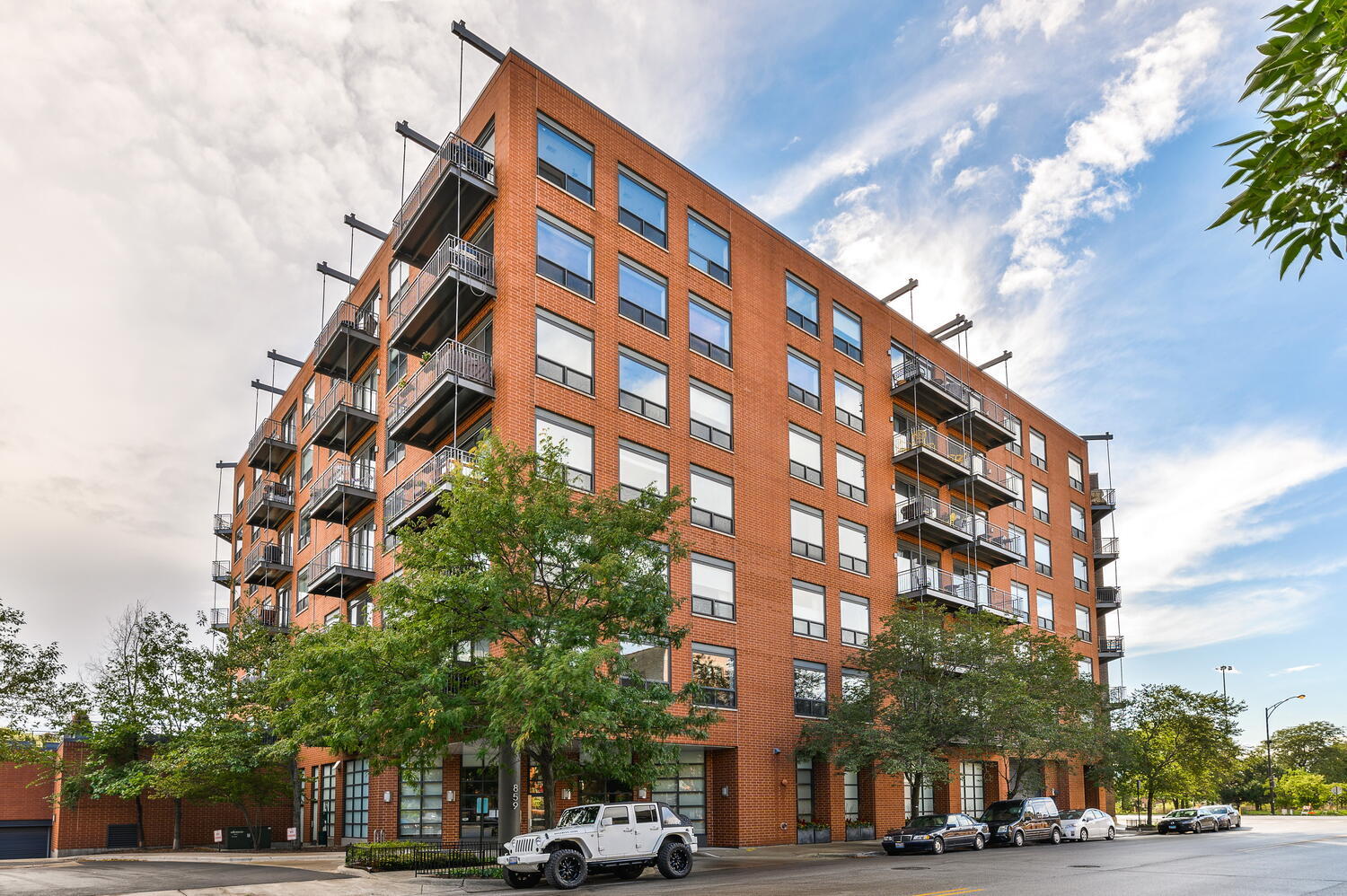 859 West Erie Street, Unit 604 Chicago, IL 60642 - Photo 1 of 32 a view of a tall building next to a road