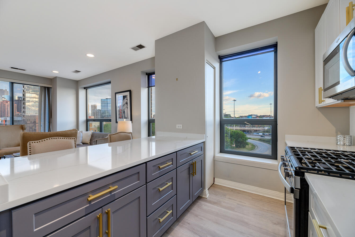 859 West Erie Street, Unit 604 Chicago, IL 60642 - Photo 12 of 32 a spacious bathroom with a granite countertop sink mirror and window