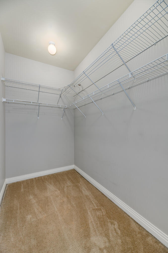 859 West Erie Street, Unit 604 Chicago, IL 60642 - Photo 20 of 32 a view of a room with racks on the wall