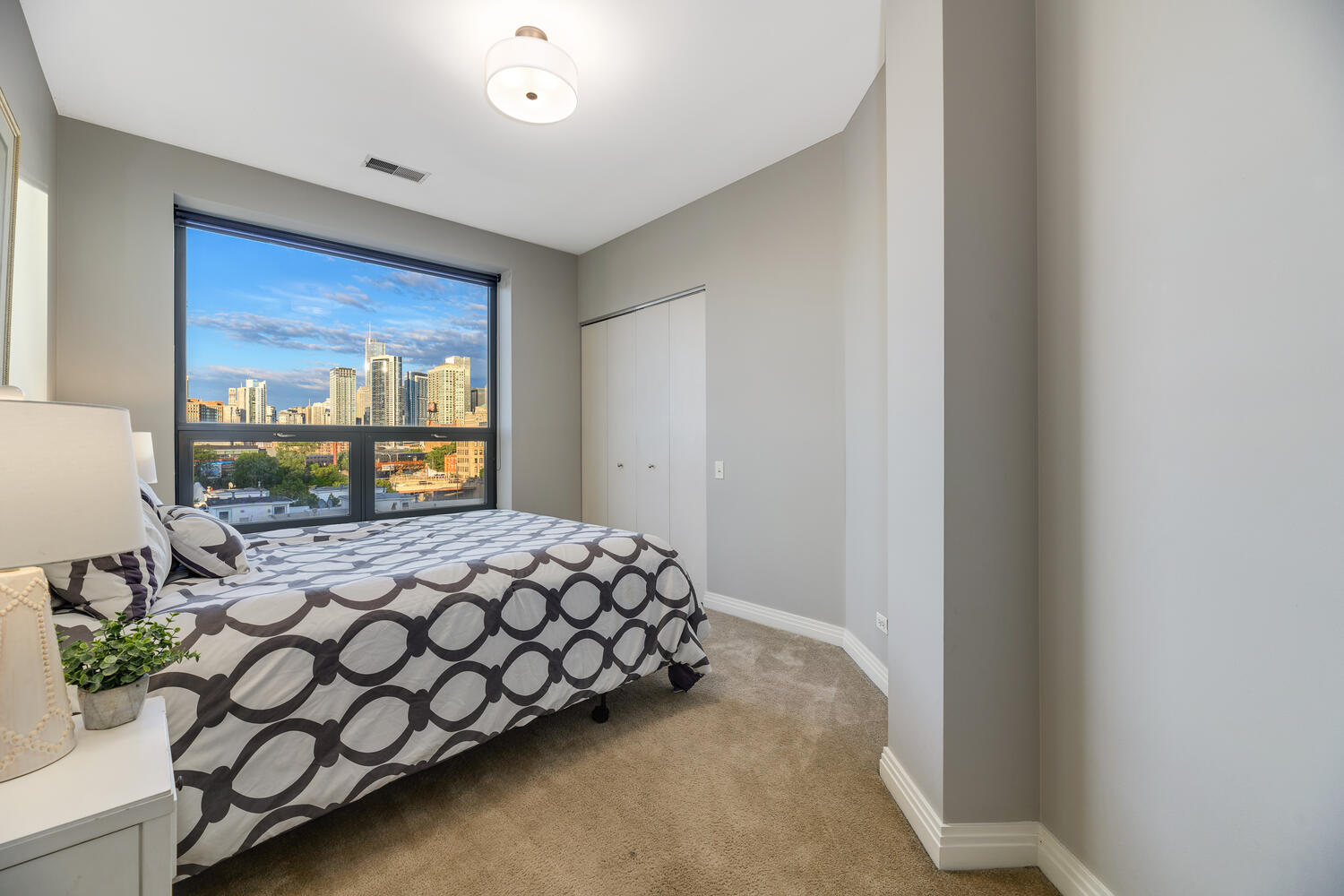 859 West Erie Street, Unit 604 Chicago, IL 60642 - Photo 21 of 32 a bedroom with a bed and window