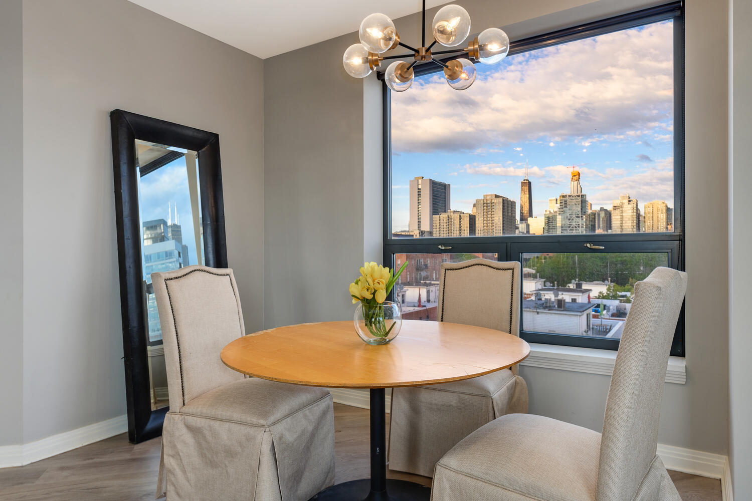 859 West Erie Street, Unit 604 Chicago, IL 60642 - Photo 7 of 32 a view of a dining room with furniture and a window