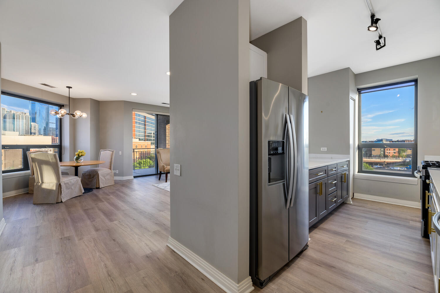 859 West Erie Street, Unit 604 Chicago, IL 60642 - Photo 10 of 32 a view of a living room kitchen and a wooden floor