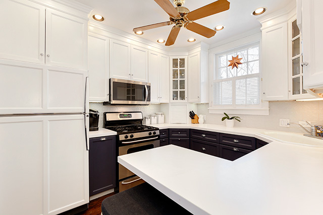 552 North York Road Hinsdale, IL 60521 - Photo 17 of 41 a kitchen with a sink a stove and microwave