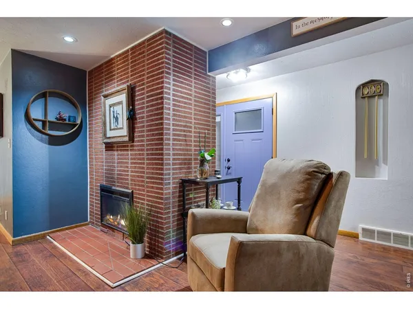 a bedroom with a large bed and a tv