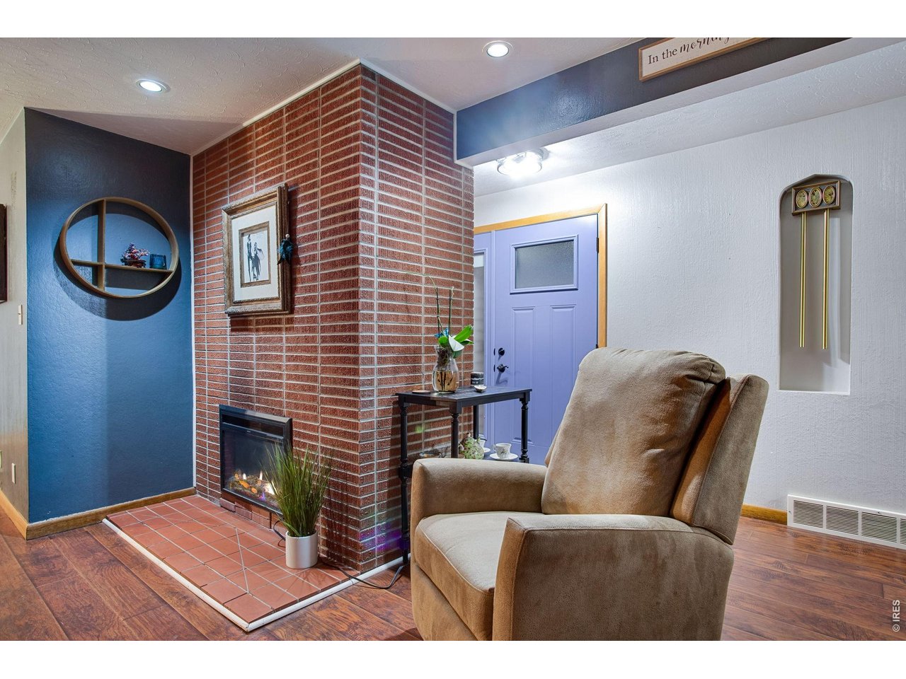 2106 13th Street Greeley, CO 80631 - Photo 16 of 42 Living Room: They don't make them like this anymore. The blue front door is new as of 2025 and has a nice storm door so you can let even more light in.
