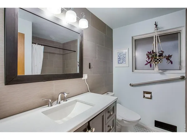 a bathroom with a shower and a bath tub