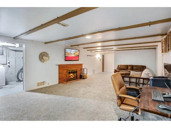 a room with furniture and a flat screen tv