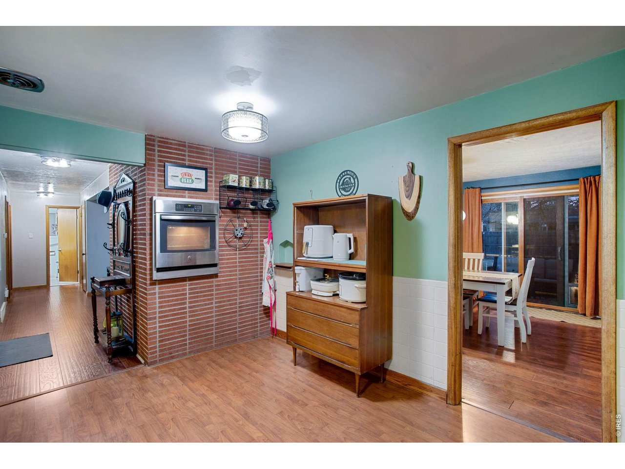 2106 13th Street Greeley, CO 80631 - Photo 7 of 42 Kitchen: Oven is built into the side of the classic 50's style brick fireplace that is in the living room.