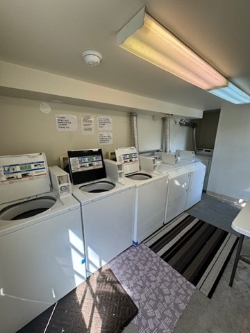 25 State Street, Unit 1 Marblehead, MA 01945 - Photo 8 of 8 a utility room with washer and dryer
