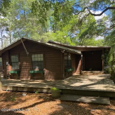 a kitchen with stainless steel appliances kitchen island granite countertop a refrigerator a stove a sink dishwasher and a microwave oven with cabinets