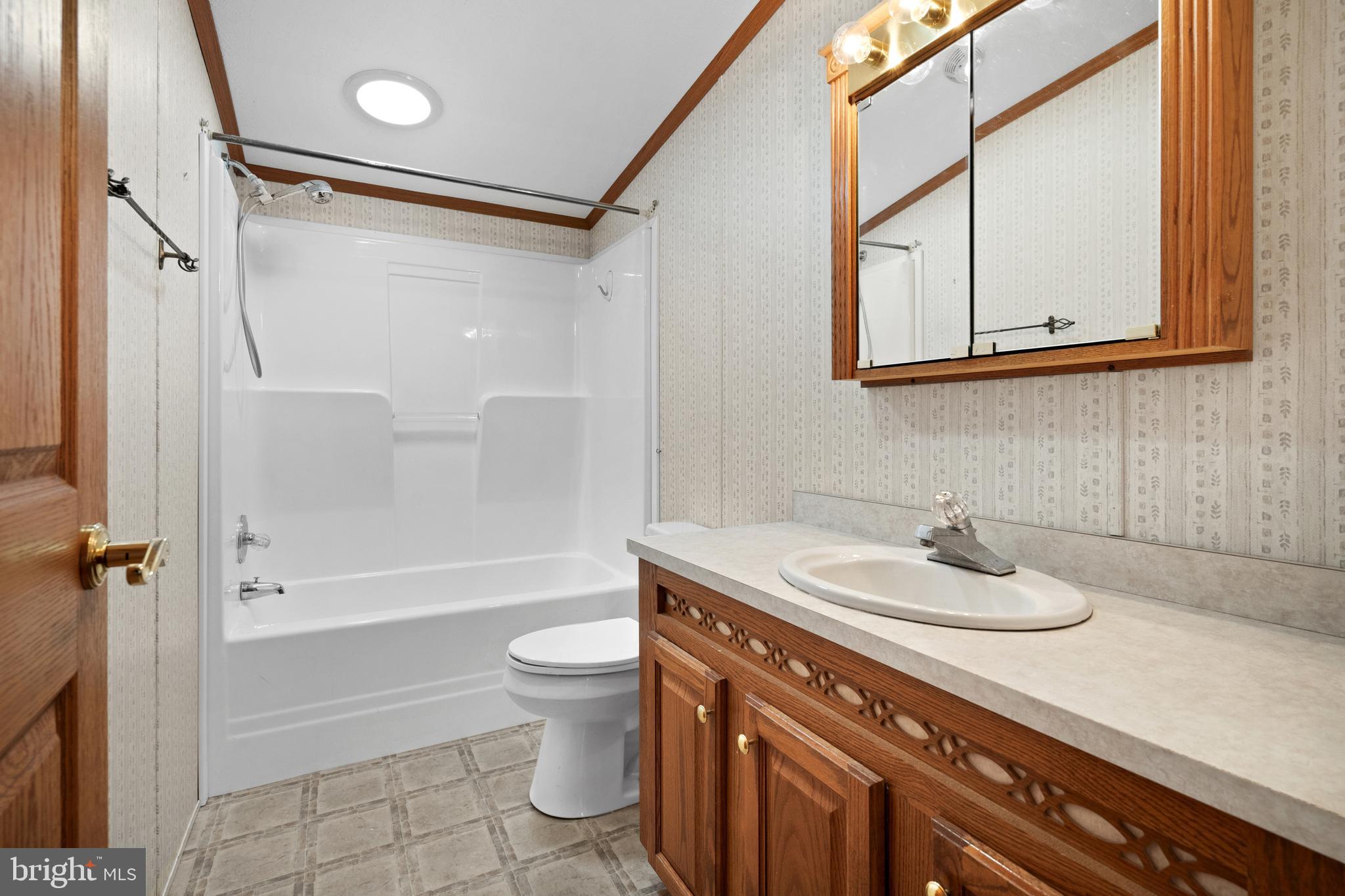 305 Bedington Road Martinsburg, WV 25404 - Photo 21 of 35 a bathroom with a sink a toilet and shower