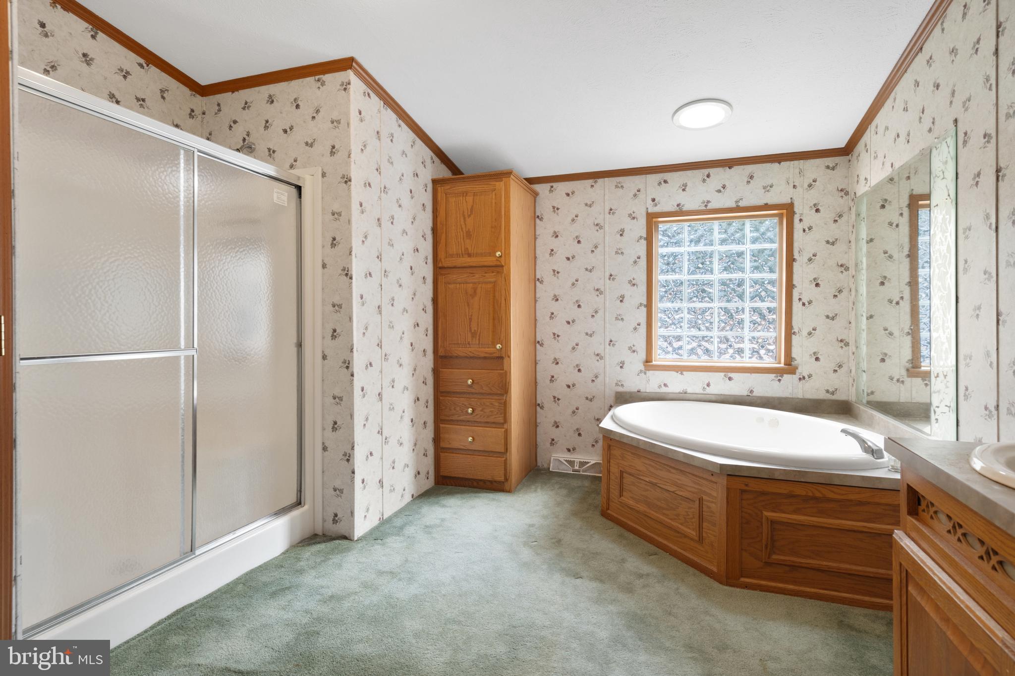 305 Bedington Road Martinsburg, WV 25404 - Photo 5 of 35 a spacious bathroom with a double vanity sink and a bathtub