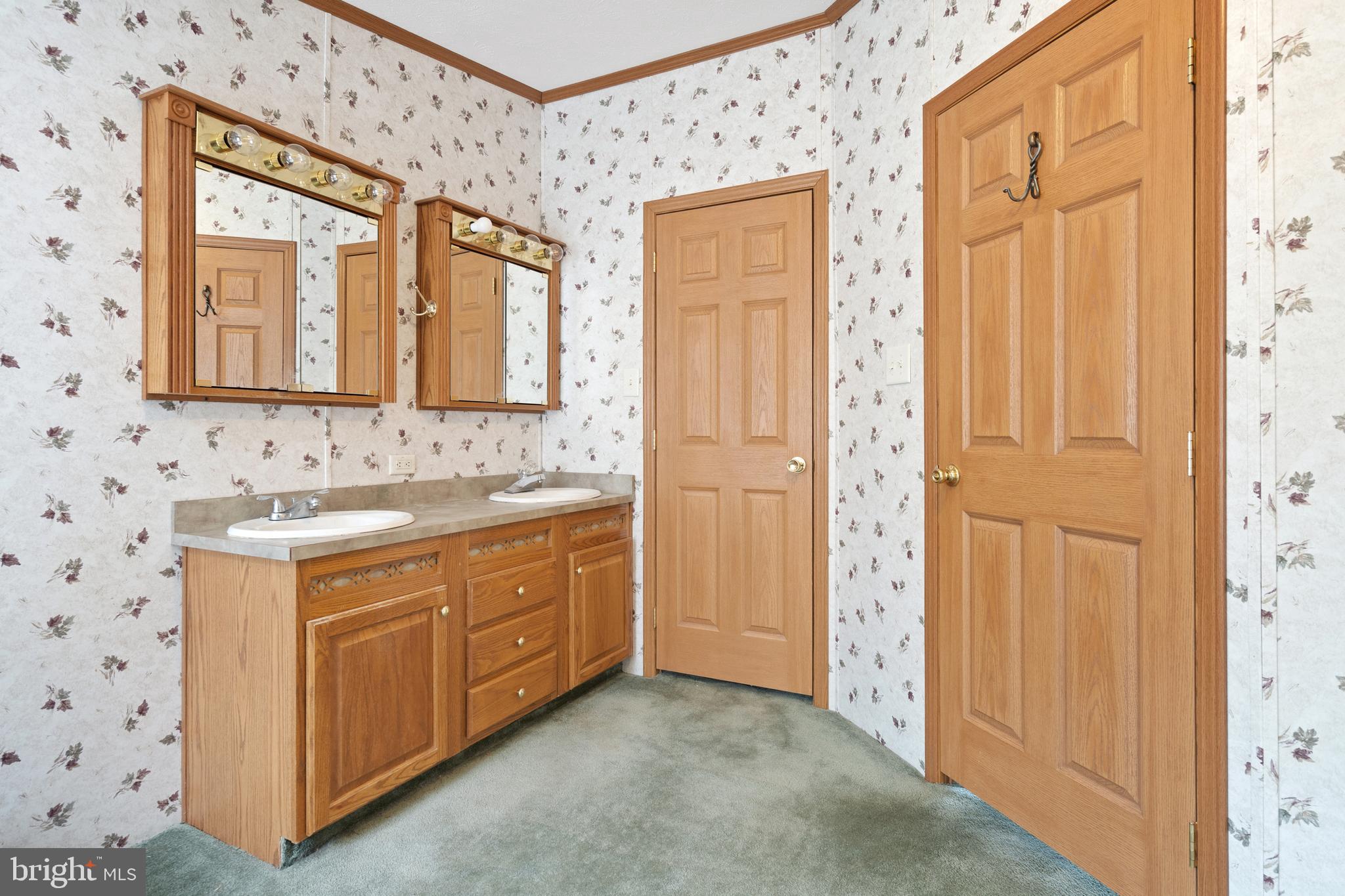 305 Bedington Road Martinsburg, WV 25404 - Photo 6 of 35 a bathroom with a sink a mirror and a shower