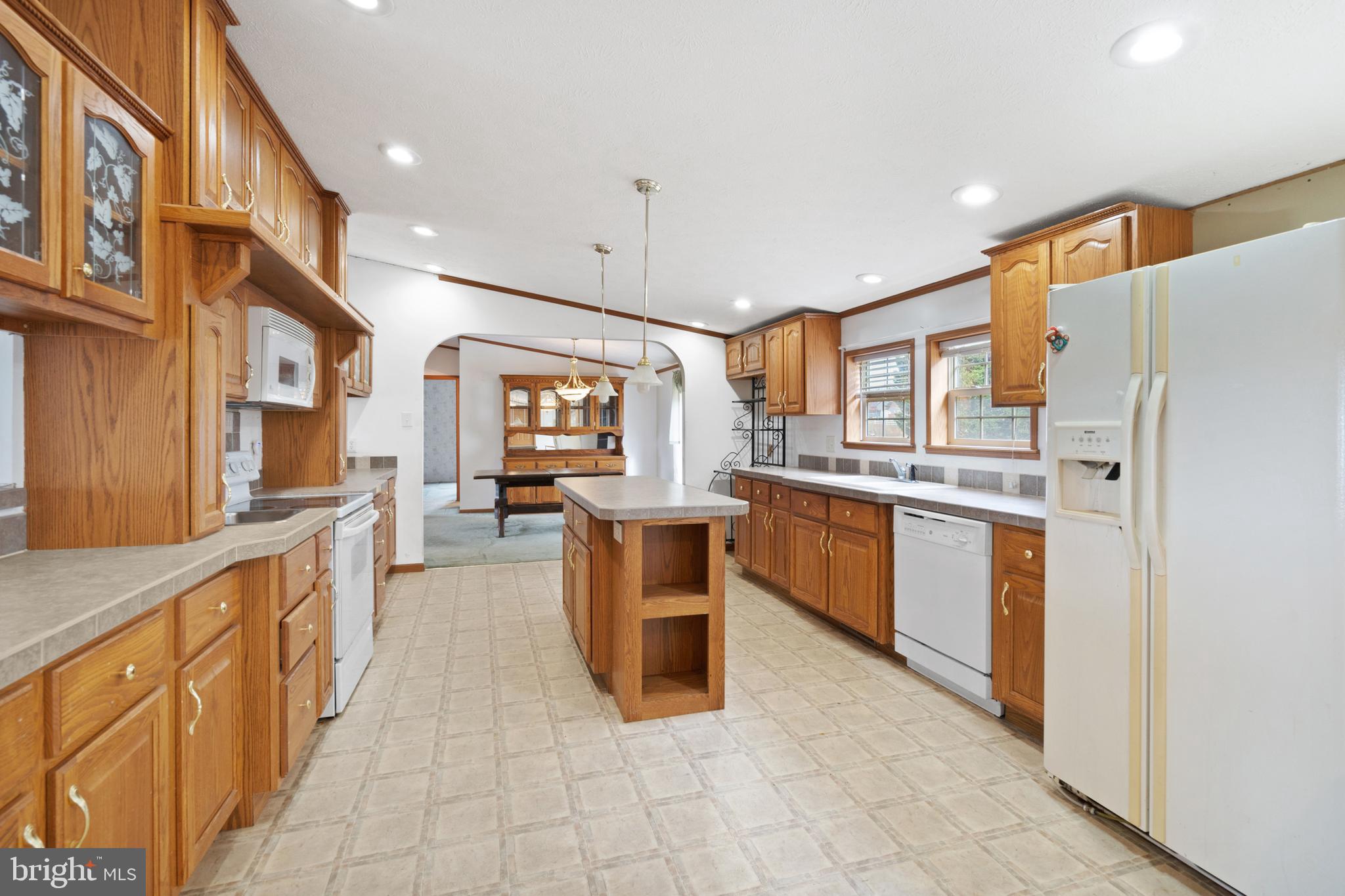 305 Bedington Road Martinsburg, WV 25404 - Photo 7 of 35 a kitchen with stainless steel appliances granite countertop a refrigerator and a sink