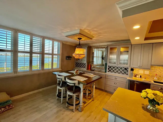 a kitchen with a sink and a stove top oven