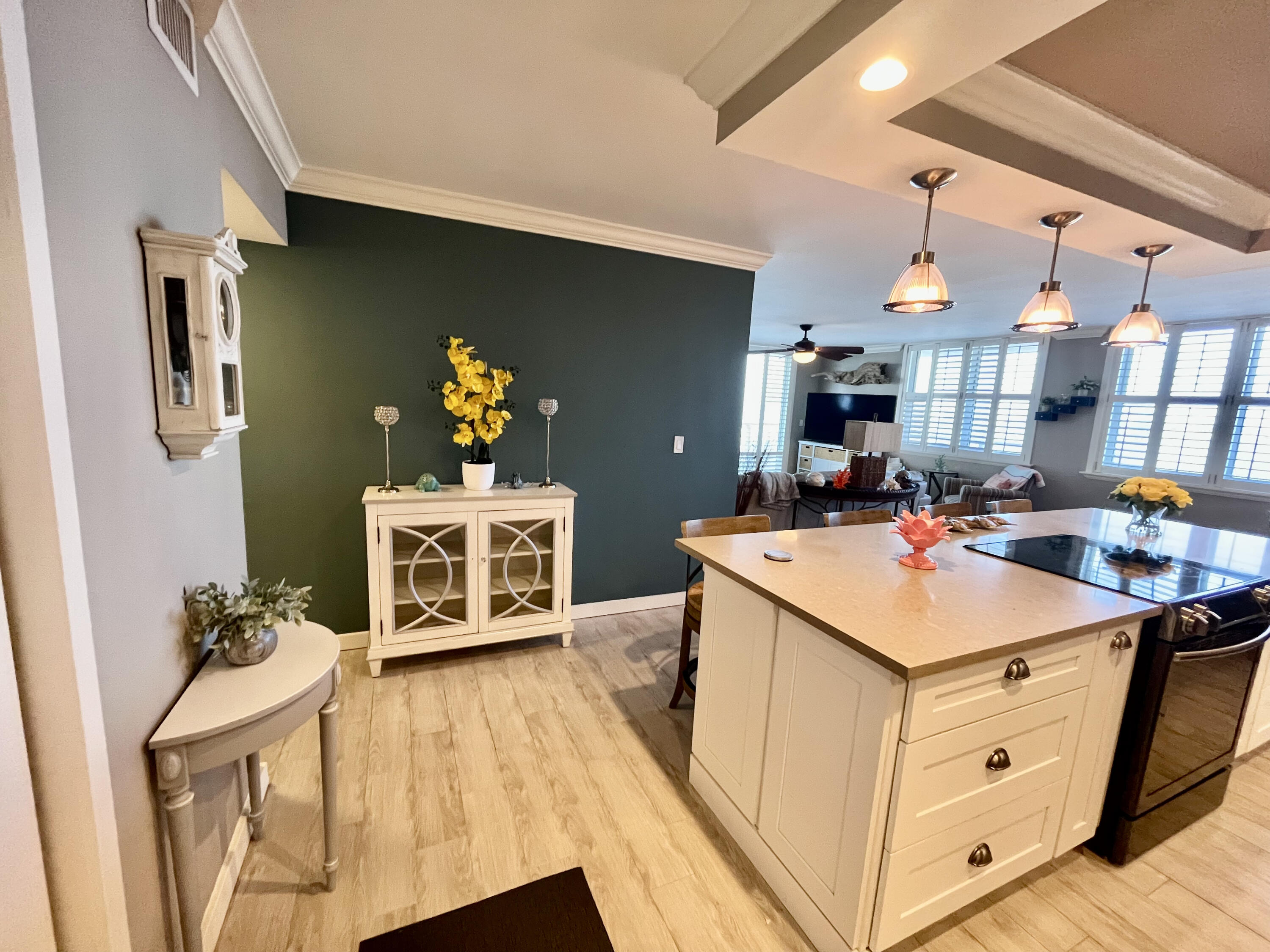 5440 North Ocean Drive, Unit 601 Riviera Beach, FL 33404 - Photo 15 of 55 a kitchen with a sink and a stove top oven