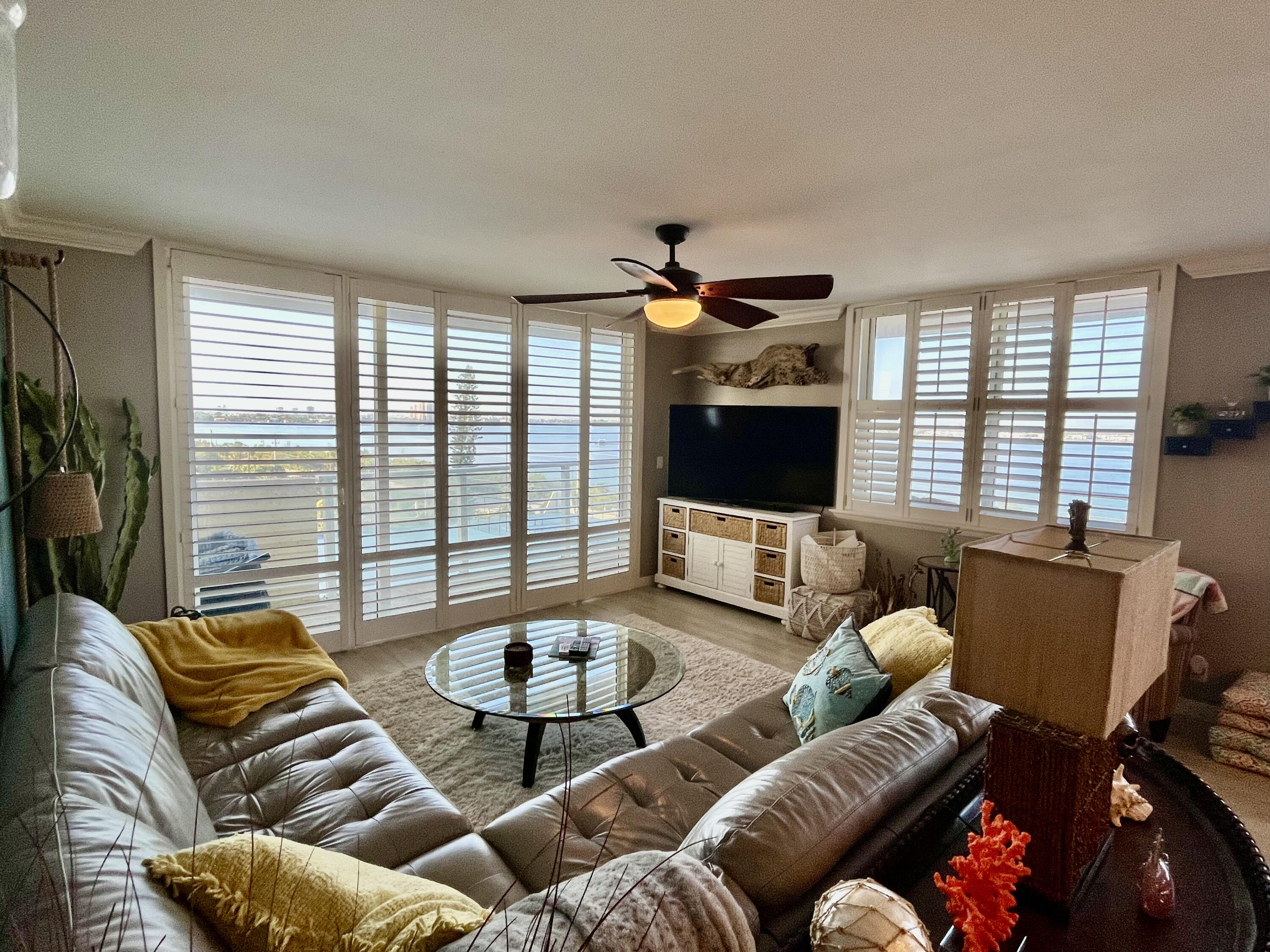 5440 North Ocean Drive, Unit 601 Riviera Beach, FL 33404 - Photo 17 of 55 a living room with furniture and a flat screen tv