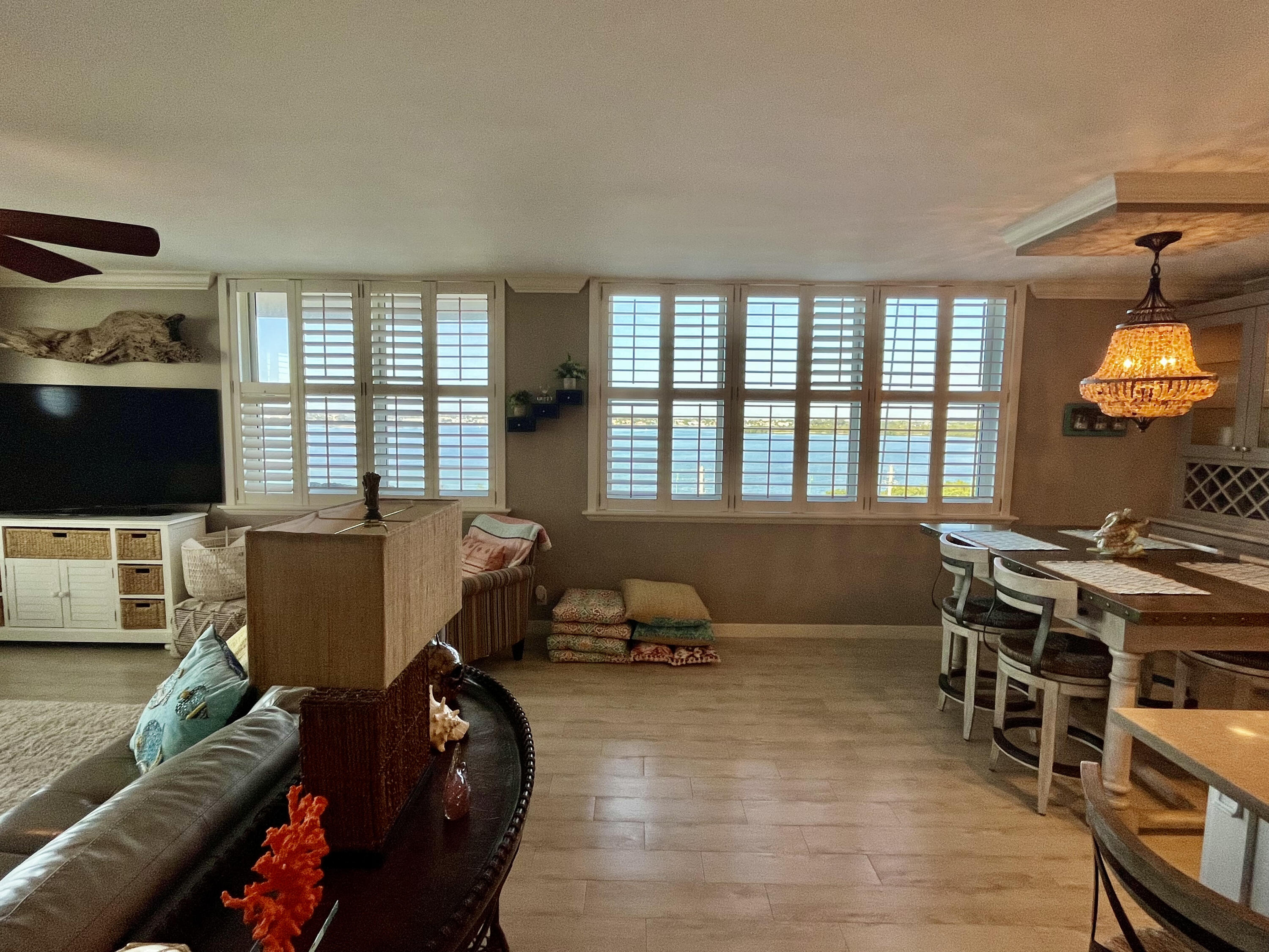 5440 North Ocean Drive, Unit 601 Riviera Beach, FL 33404 - Photo 20 of 55 a living room with furniture and a flat screen tv