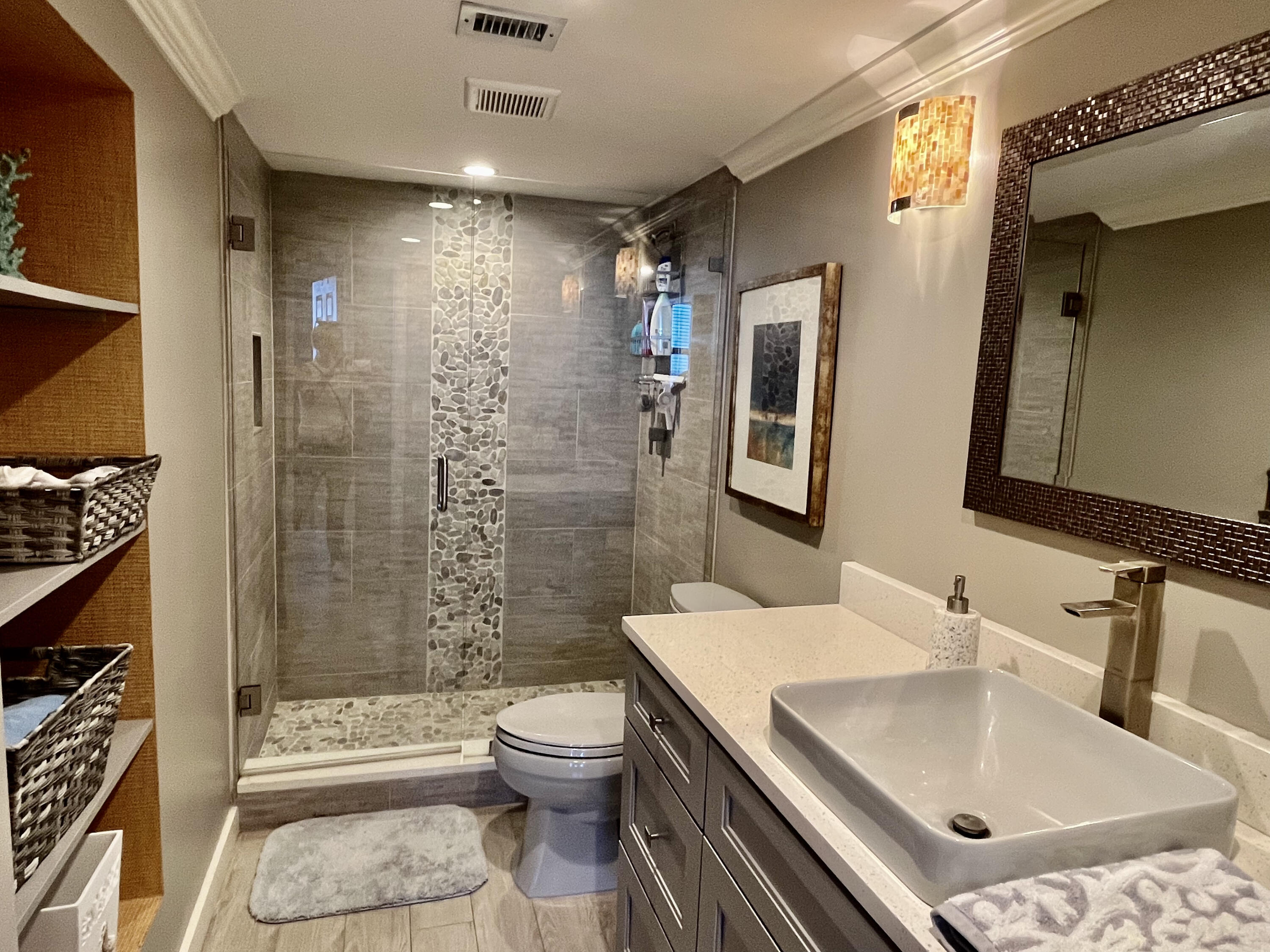 5440 North Ocean Drive, Unit 601 Riviera Beach, FL 33404 - Photo 22 of 55 a bathroom with a sink toilet and shower