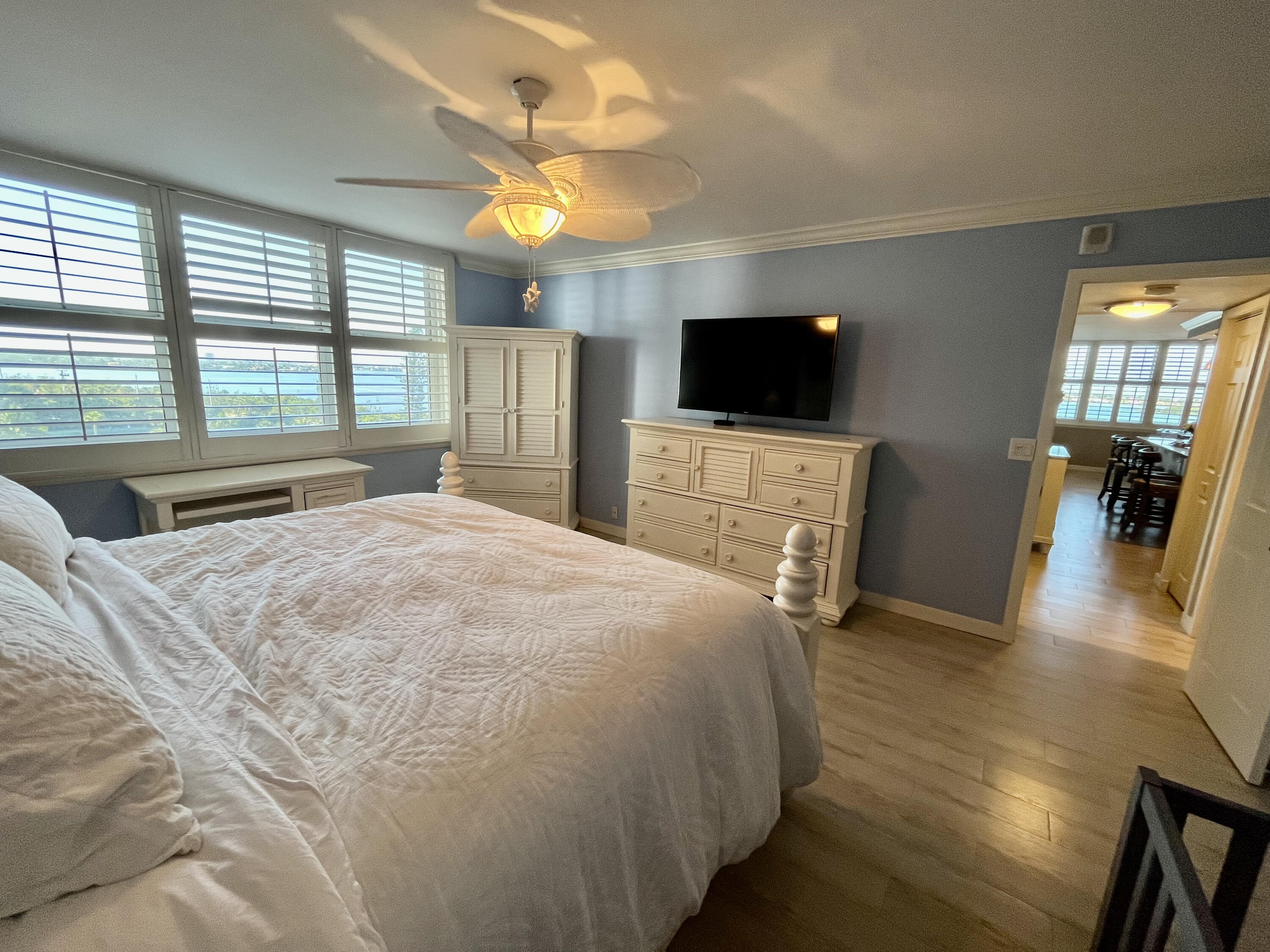 5440 North Ocean Drive, Unit 601 Riviera Beach, FL 33404 - Photo 28 of 55 a bedroom with a bed and a flat screen tv