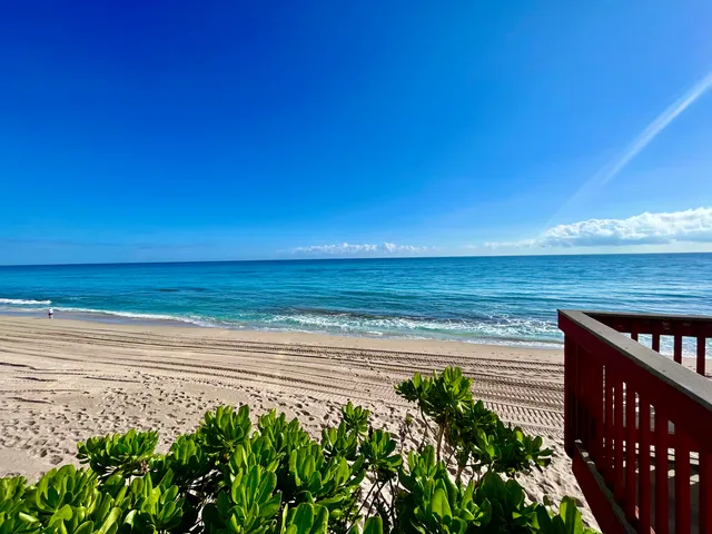 a view of a lake with a house in the background