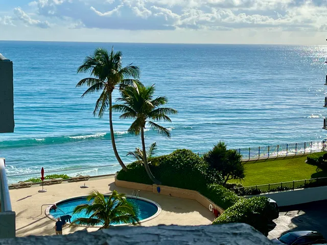 a view of a balcony with an ocean view