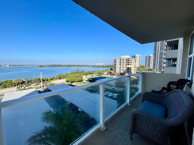 a view of a swimming pool with a table and chairs