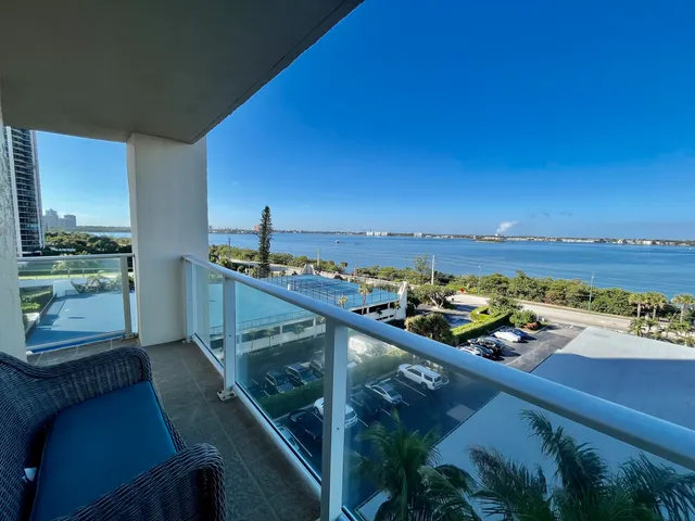a living room with lots of furniture and a chandelier