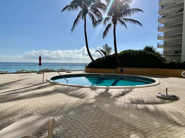 a kitchen with a sink appliances and cabinets