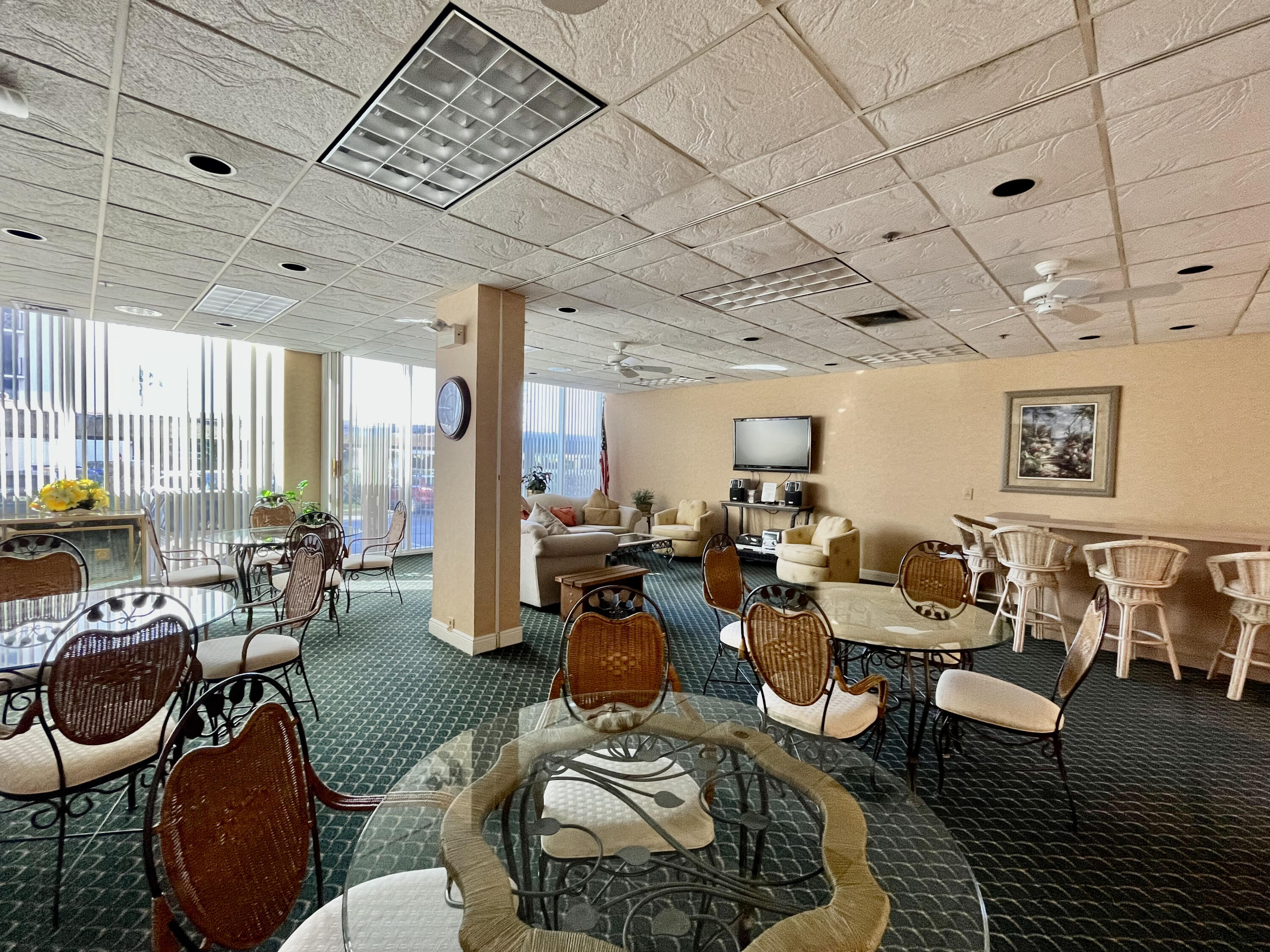 5440 North Ocean Drive, Unit 601 Riviera Beach, FL 33404 - Photo 43 of 55 a living room with lots of furniture and a chandelier