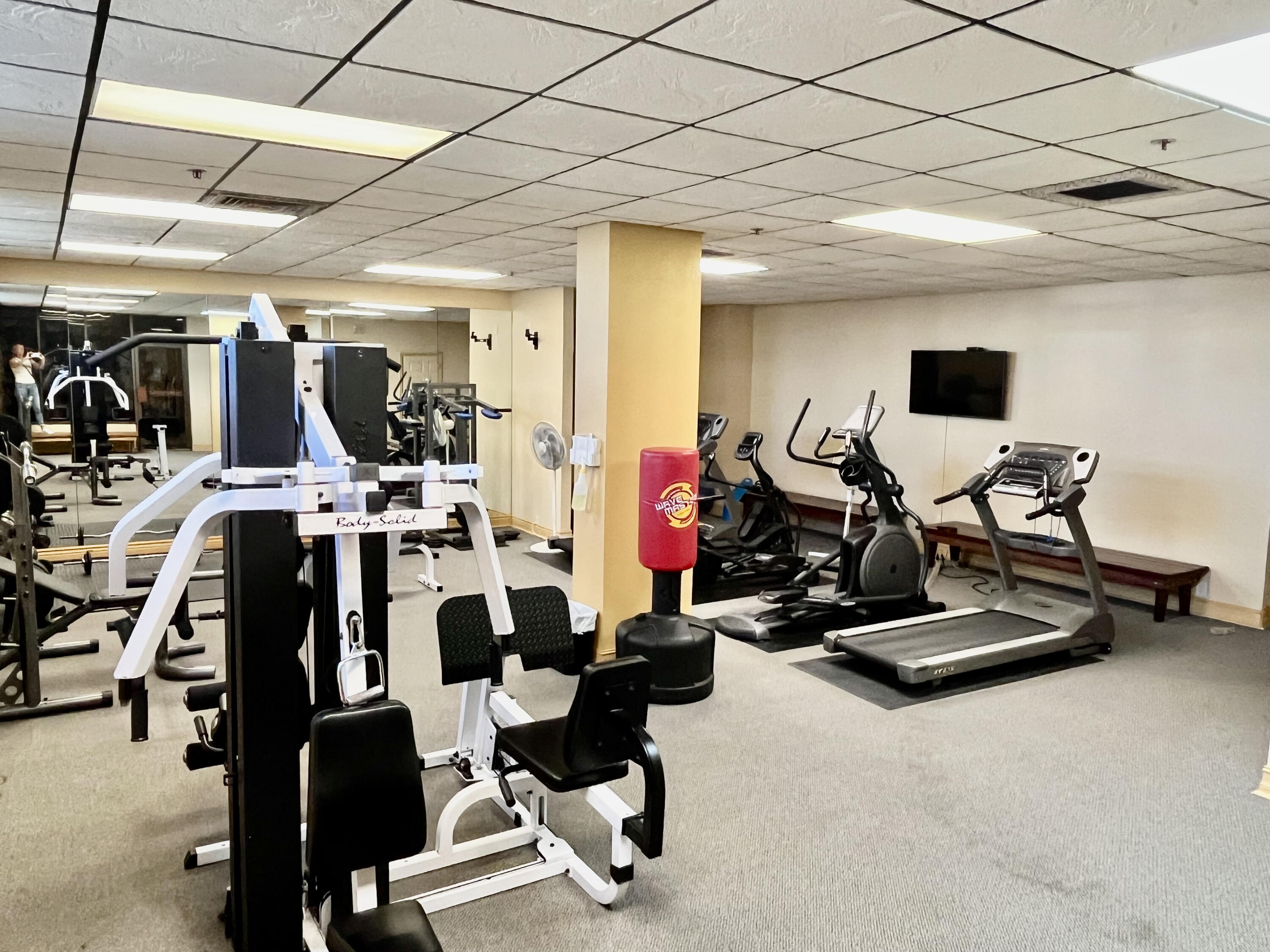 5440 North Ocean Drive, Unit 601 Riviera Beach, FL 33404 - Photo 48 of 55 a room with gym equipment and a large window