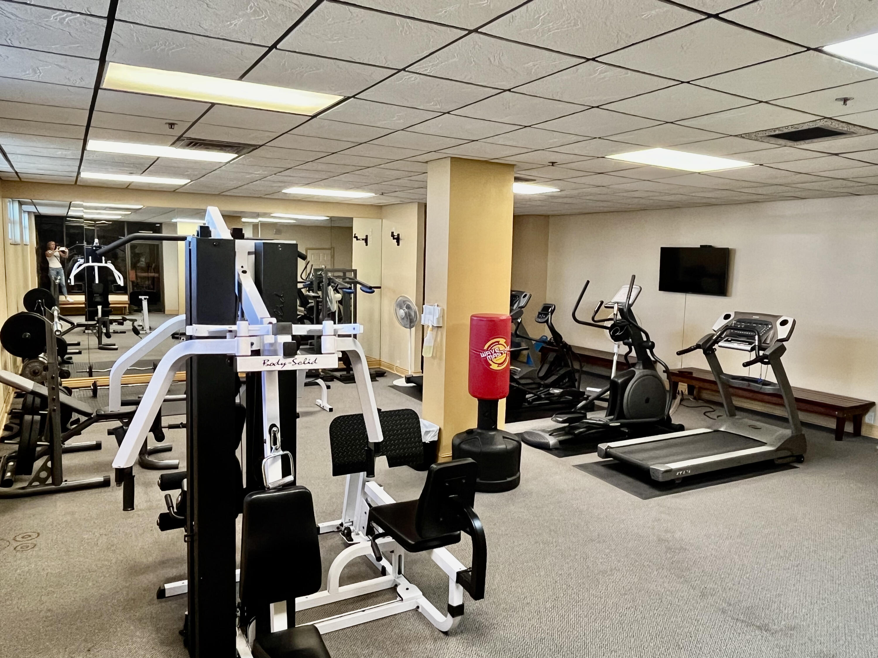 5440 North Ocean Drive, Unit 601 Riviera Beach, FL 33404 - Photo 49 of 55 a view of a room with gym equipment