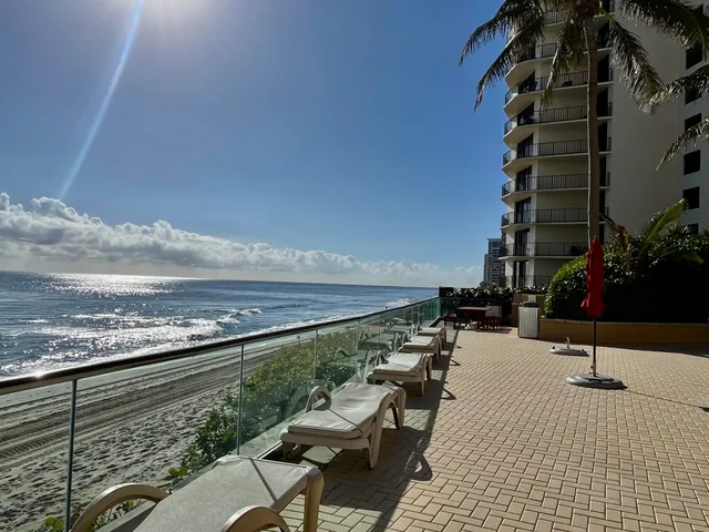 a kitchen that has a sink and a stove